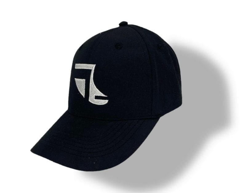 Angled image of Black ShoreTees Baseball Cap with White embroidered Fin Logo